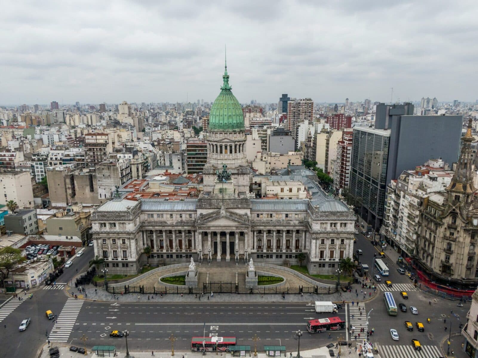 Aerial view of Argentine National Congress building with green dome in Buenos Aires city center surrounded by urban landscape
