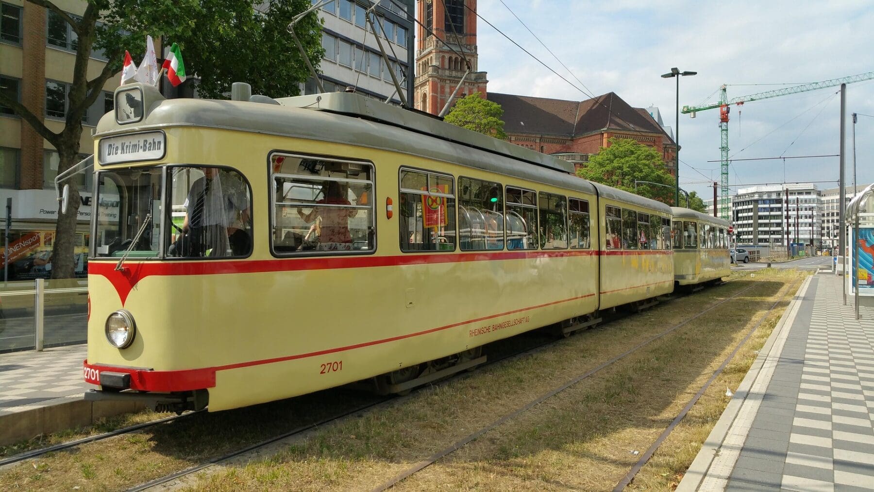 Historic cream and red tram in Düsseldorf city streets