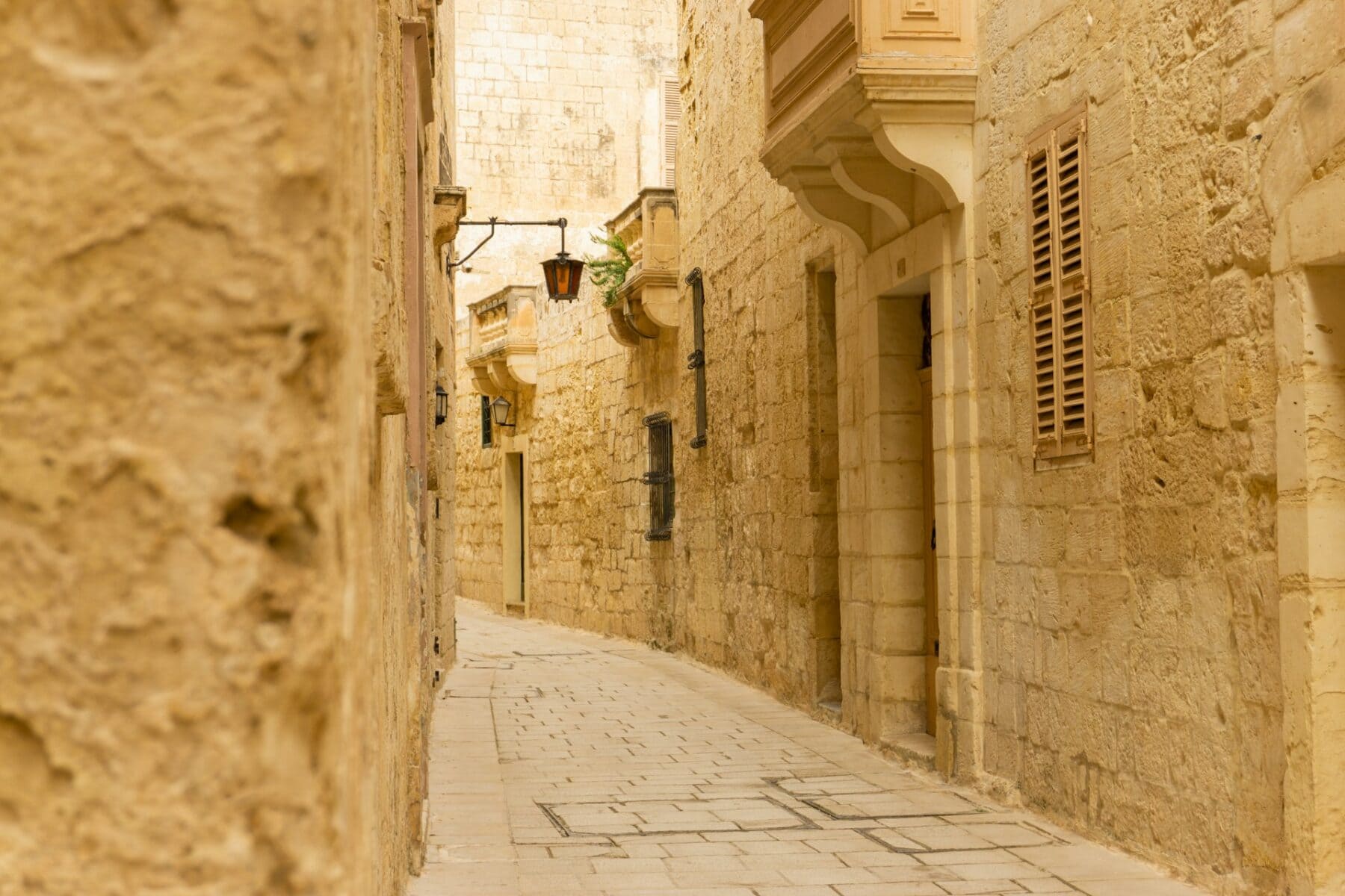 Narrow stone alleyway in the medieval city of Mdina, Malta