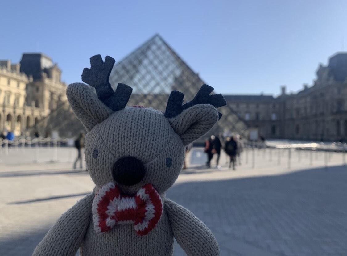 Rupert the reindeer with the Louvre Pyramid in Paris