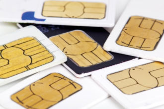 Close-up of multiple SIM cards, illustrating mobile connectivity choices and eSIM alternatives for international travel