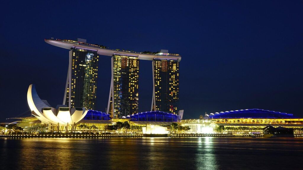 Marina Bay Sands hotel and ArtScience Museum illuminated at night in Singapore