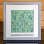 Digital weather station showing temperature, humidity, and a five-day weather forecast, representing modern weather apps.