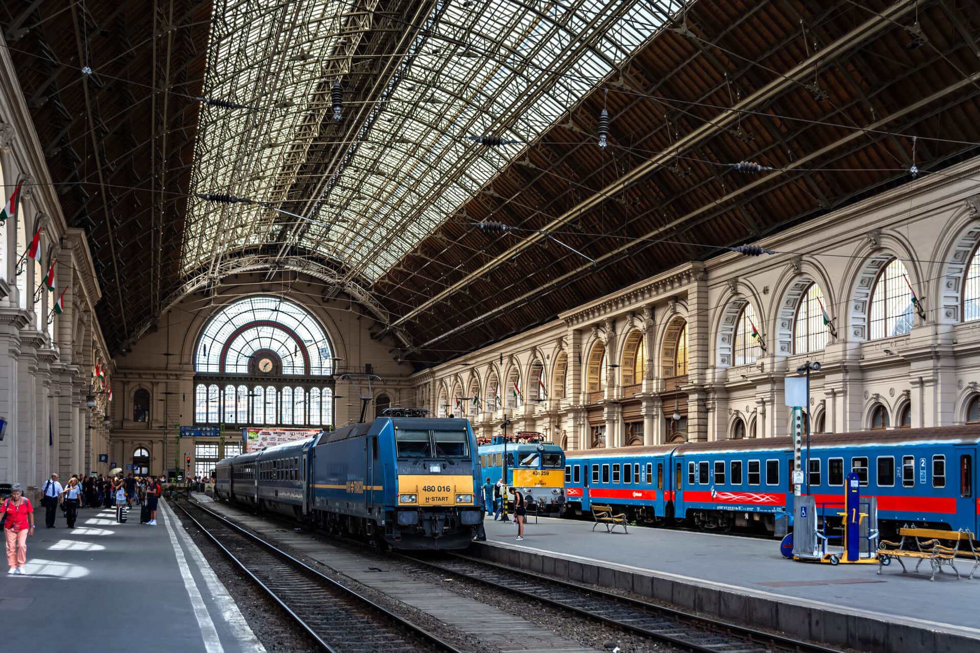 Interior view of Budapest Keleti Railway Station with trains on the platform under the grand glass roof