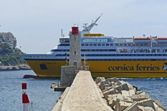Corsica Ferries Mega Express Two passing a lighthouse in port
