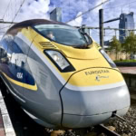 Eurostar high-speed train waiting at the platform on a sunny day