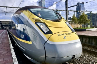Eurostar high-speed train waiting at the platform on a sunny day