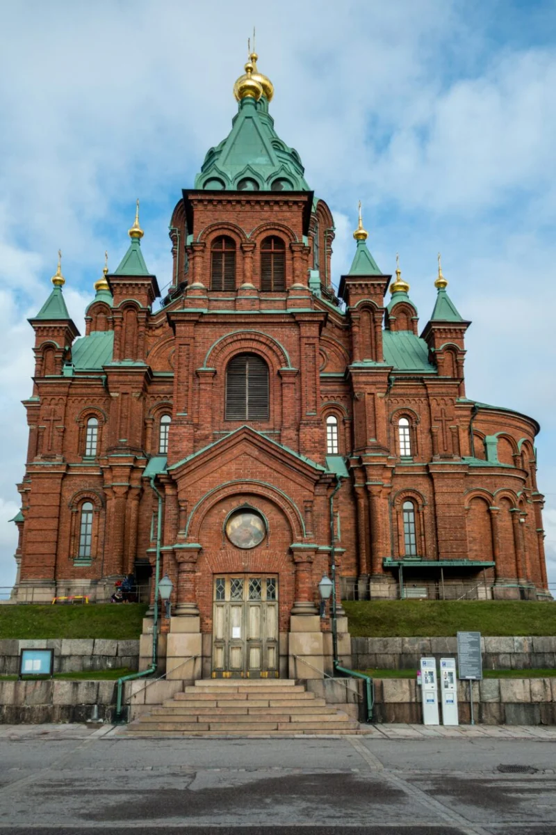 Red-brick Uspenski Cathedral with golden onion domes in Helsinki