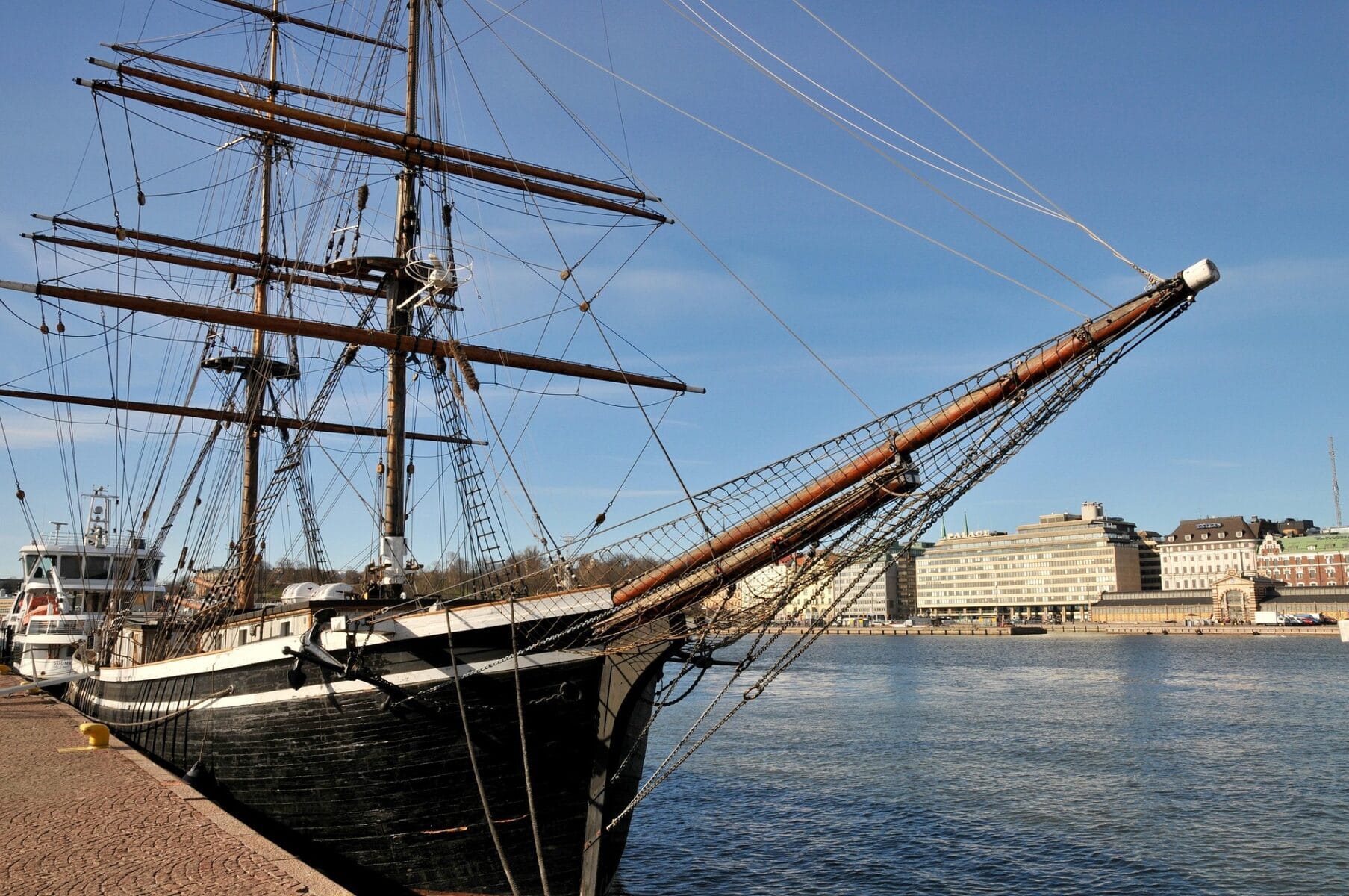 Historic tall ship moored at Helsinki harbour on a sunny day