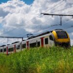 Belgian NMBS/SNCB train running through the countryside.