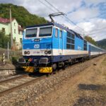 Blue ČD train in the Czech countryside.
