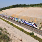 French TGV high-speed train on a dedicated line in the countryside