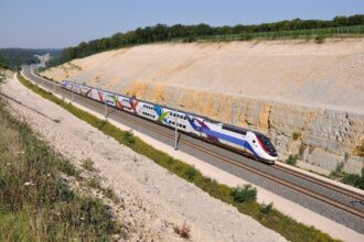 French TGV high-speed train on a dedicated line in the countryside