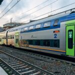 Trenitalia double-decker regional train at an Italian station.