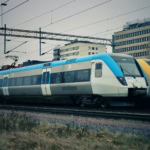 Two Västtågen regional trains at a Swedish city station.