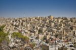 Cityscape of Amman, Jordan with hillside buildings