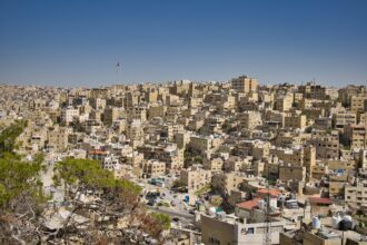 Cityscape of Amman, Jordan with hillside buildings