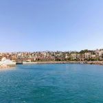 Scenic view of Aqaba’s marina and colourful waterfront buildings overlooking the Red Sea.