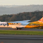 Aurigny Air Services ATR-72 aircraft in Guernsey livery taxiing at sunrise
