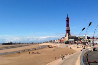 Blackpool Tower and Central Beach on a sunny day in Lancashire, England