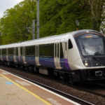 Elizabeth Line train approaching a station platform in London