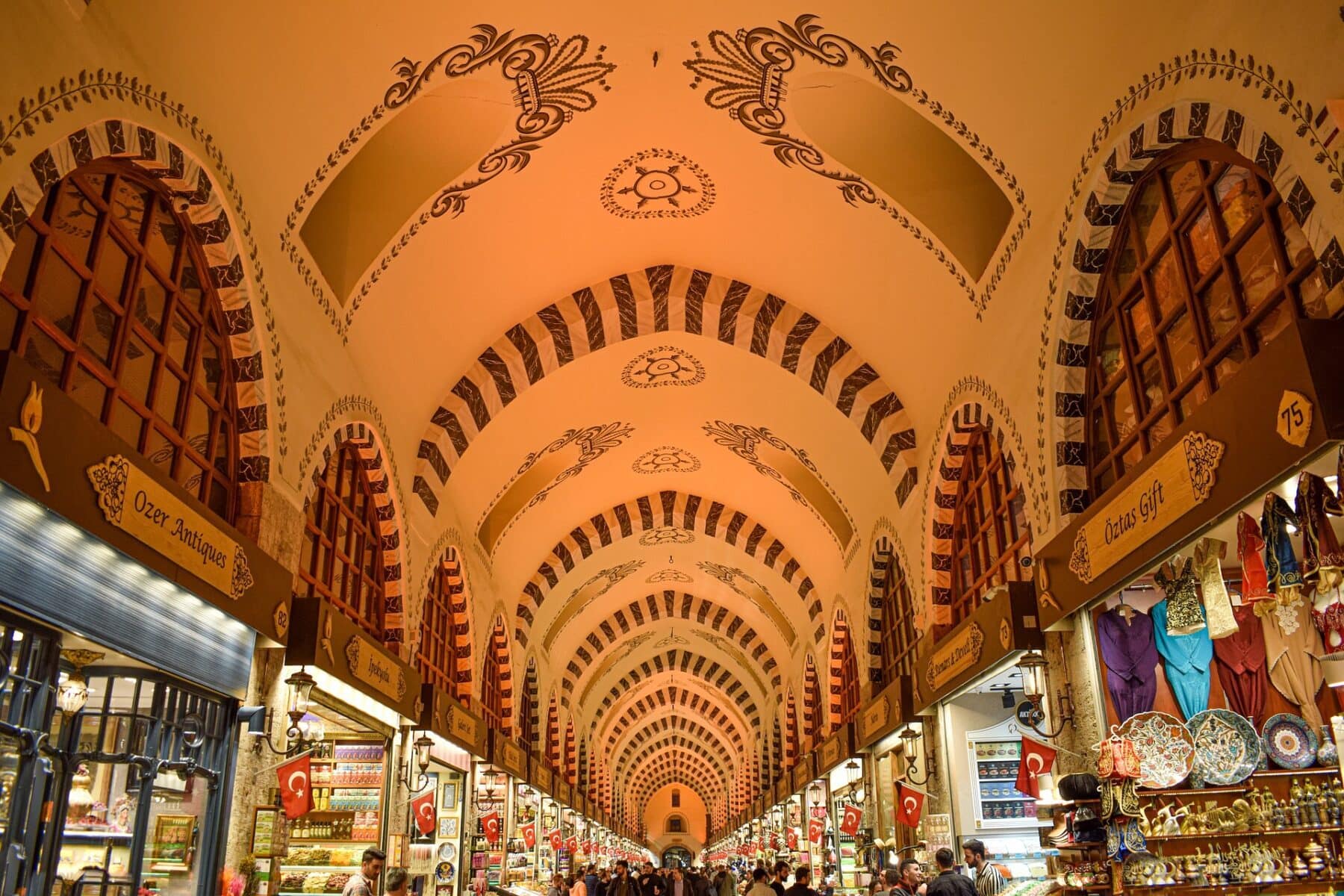 Interior of the Spice Bazaar in Istanbul, with arched ceilings and colourful stalls.