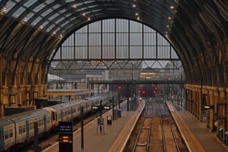 Kingโs Cross Station platforms at dusk, London, England