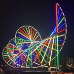 Cycle light installation with rainbow spirals at River of Light Liverpool 2025, part of the Science of Light trail