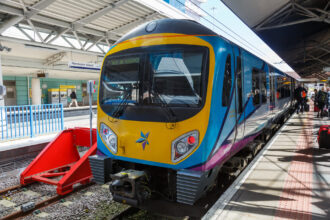 TransPennine Express train at Manchester Airport railway station platform