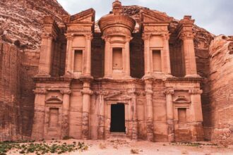 Obelisk Tomb and Triclinium carved into sandstone cliffs in Petra, Jordan