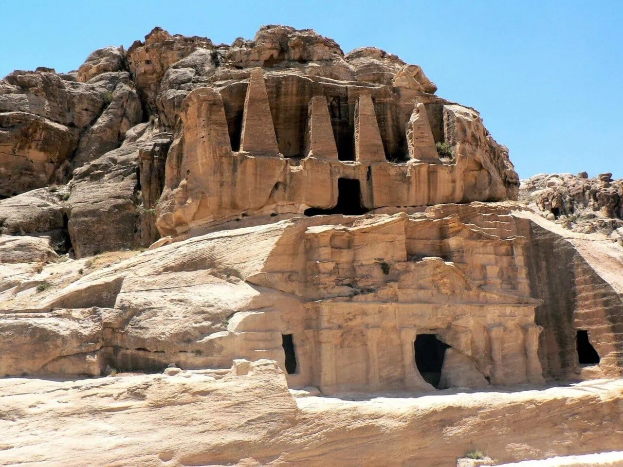 The Monastery Ad-Deir carved into red sandstone cliffs in Petra, Jordan