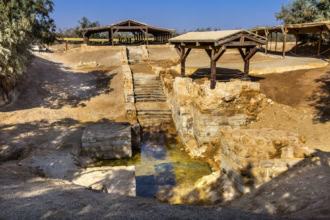 Archaeological remains at the Baptism Site of Jesus in Jordan, showing ancient steps and water channels.