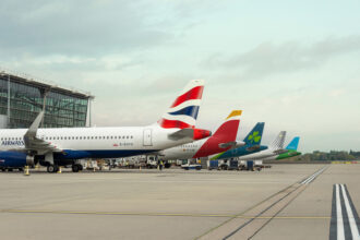 Line-up of IAG airline aircraft tails — British Airways, Iberia, Aer Lingus, Vueling and LEVEL — at London Heathrow ahead of the Starlink Wi-Fi installation programme.