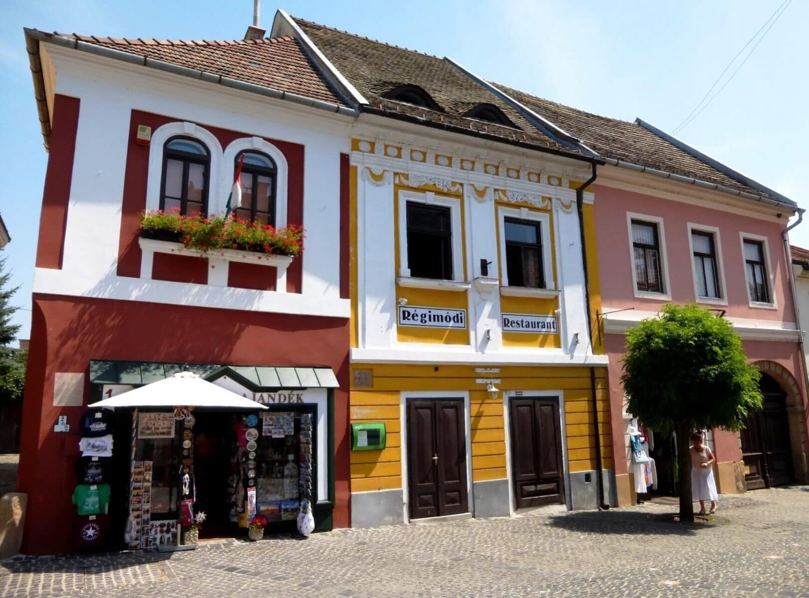 Colourful historic buildings and a souvenir shop in Szentendre’s old town.