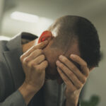 Passenger suffering ear pain on a flight due to cabin pressure changes