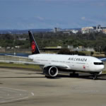 Air Canada aircraft taxiing on airport runway before departure
