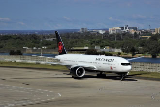 Air Canada aircraft taxiing on airport runway before departure
