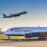 British Airways Airbus A380 on the runway with aircraft departing in the background