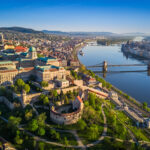Aerial view of Buda Castle overlooking the Danube River and Chain Bridge in Budapest Hungary