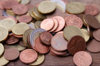 Pile of euro coins representing saving money on holiday and travel budgeting