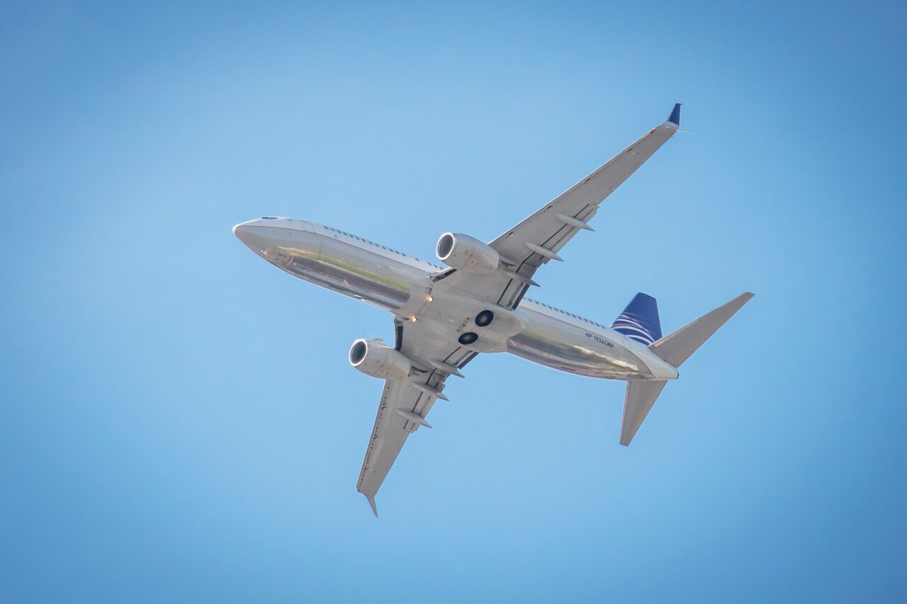 Copa Airlines aircraft flying in clear blue sky