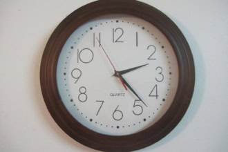 Wall clock showing time change concept for daylight saving time