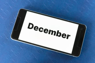 December travel destinations planning on smartphone screen