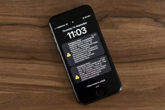 Smartphone displaying emergency alert notification used in European warning systems