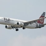 Fiji Airways aircraft landing at airport runway