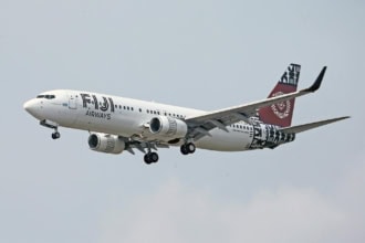Fiji Airways aircraft landing at airport runway