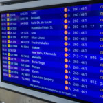 Airport departure board showing multiple cancelled flights