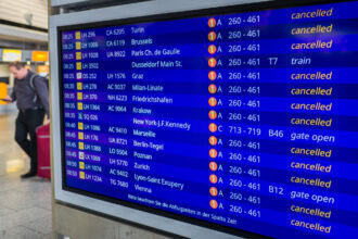 Airport departure board showing multiple cancelled flights