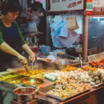 Street food stall cooking food safely while travelling abroad