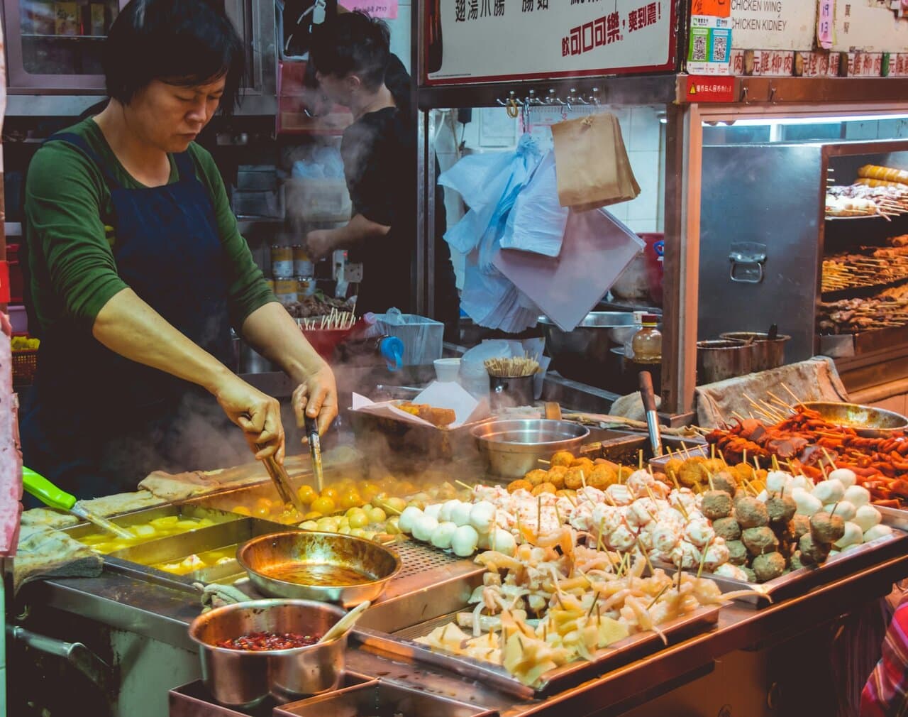 Street food stall cooking food safely while travelling abroad
